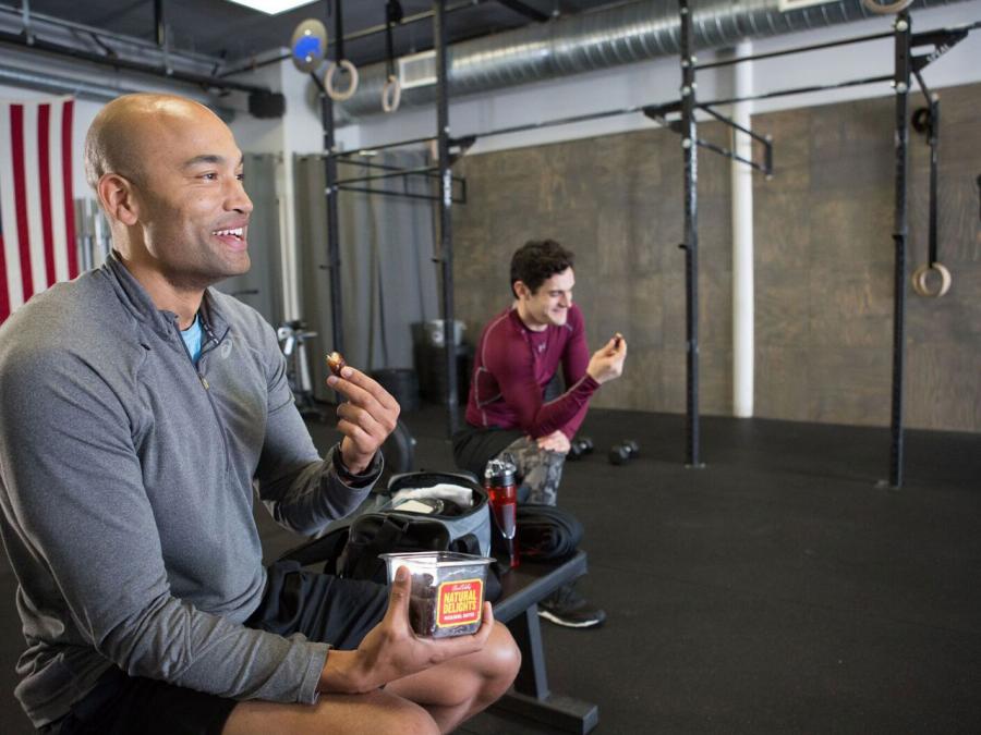 Man at gym eating dates Man at gym eating dates