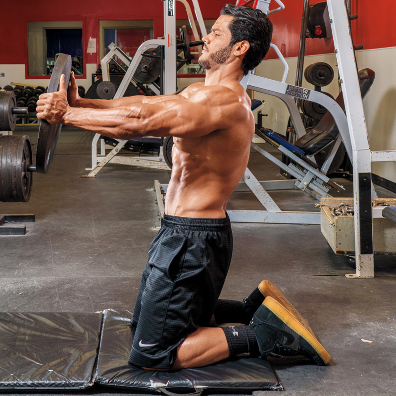 How to Do a Kneeling Plate Chest Press Muscle & Fitness