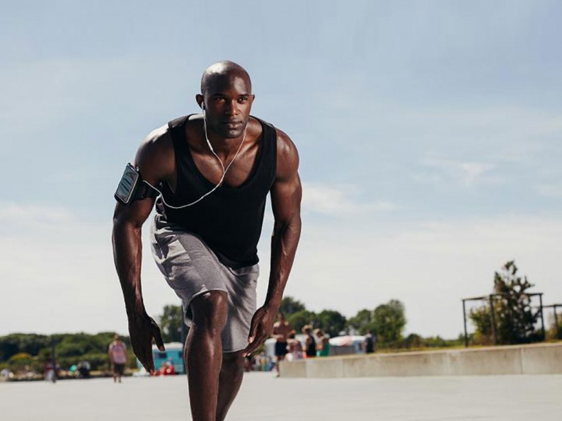 The ultimate workout program to become an all-around athlete Man running with an iPod