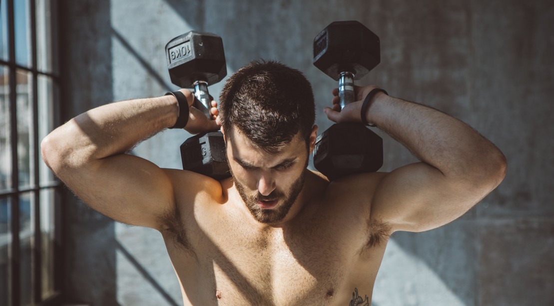 Man Exercising With Dumbbells Man Exercising With Dumbbells