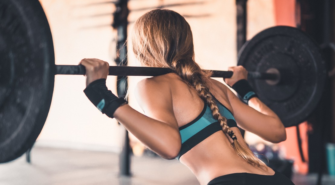Woman Doing Back Squats Woman Doing Back Squats